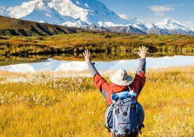 Hiker and Mt McKinley in the fall from Backcountry Unit 14 in Denali National Park, Alaska.